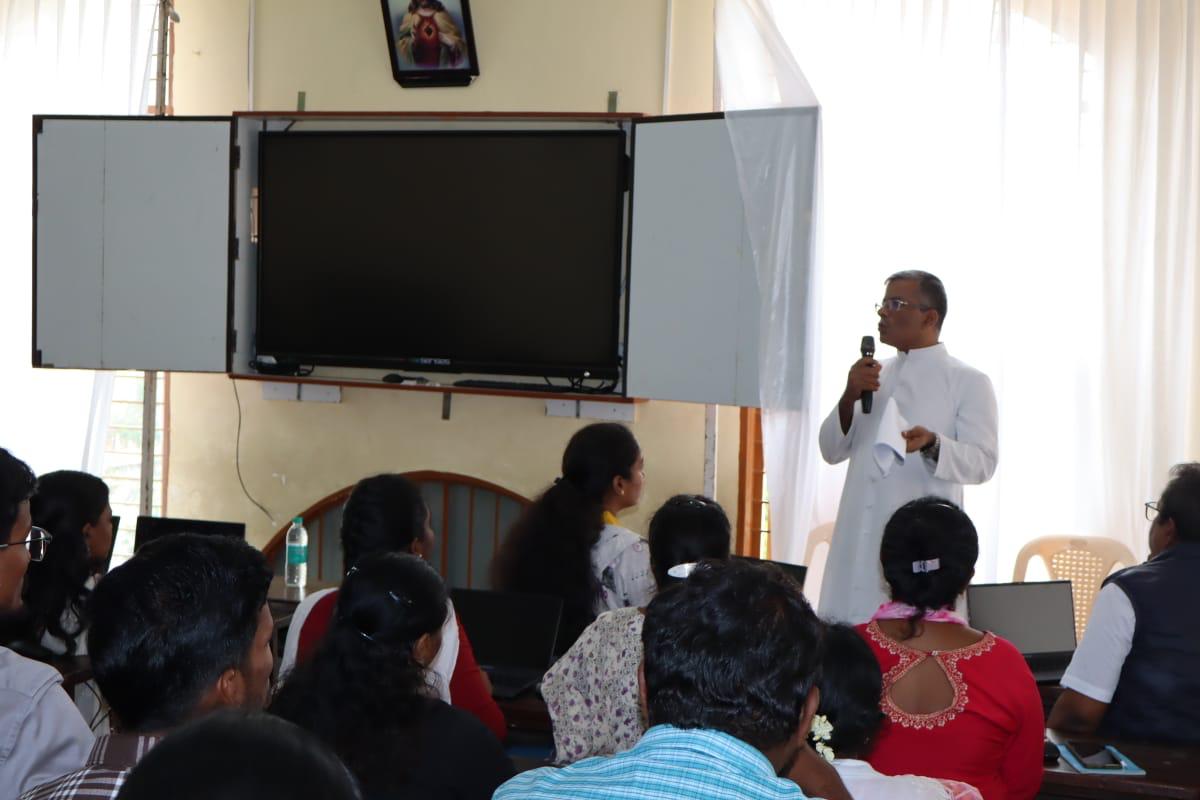 Resource person giving guidance during a session