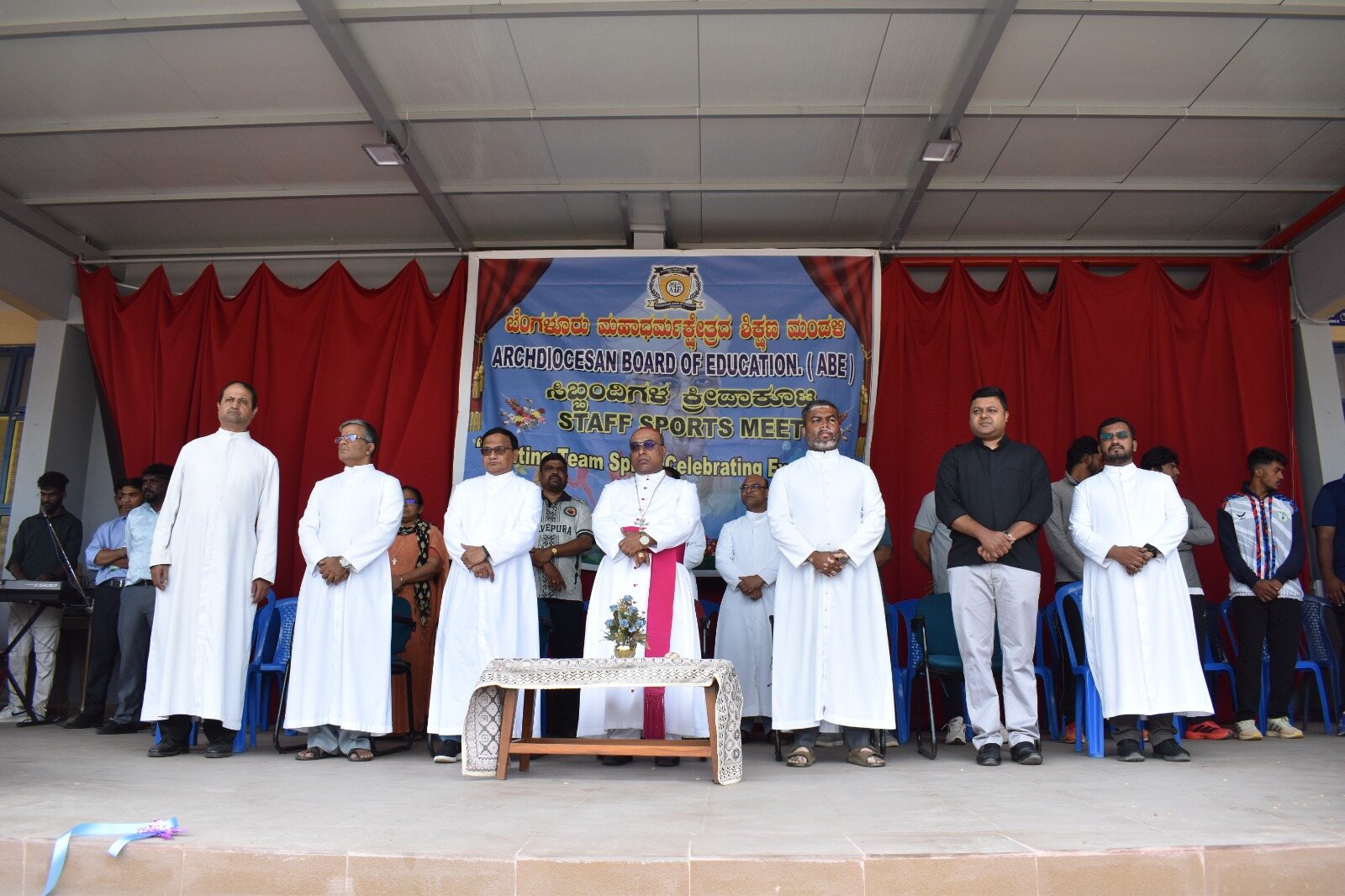 ABE leadership and clergy on stage