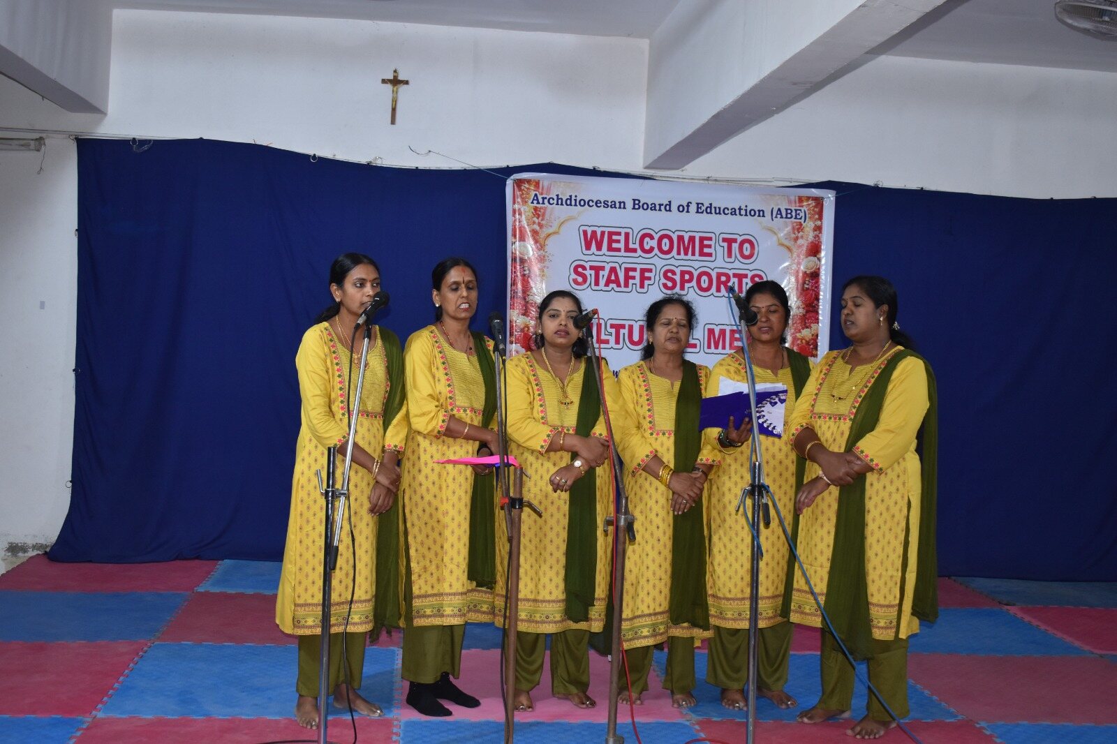Staff members presenting a song