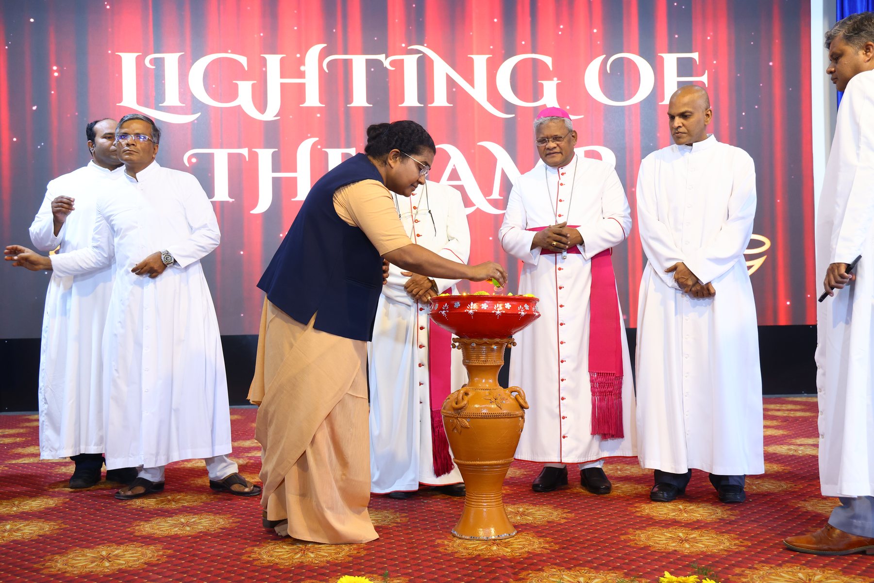 Guest lighting the ceremonial lamp